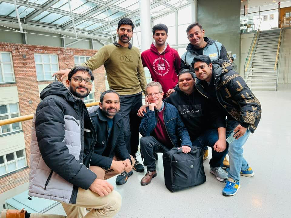 Aaron Hakso with a smiling group of his students